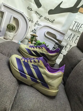 Adidas أحذية جري ذهبية بنفسجية معدنية مع ثلاث خطوط متداخلة في الجزء العلوي 7