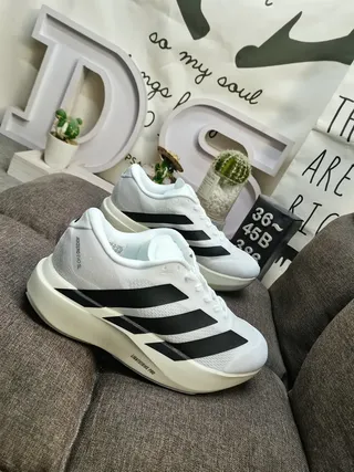 Adidas Zapatos de correr blancos y negros con tres rayas 9