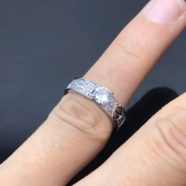 Cartier Love Ring Silver and Gold Pavé Diamond Central Stone Rings 2