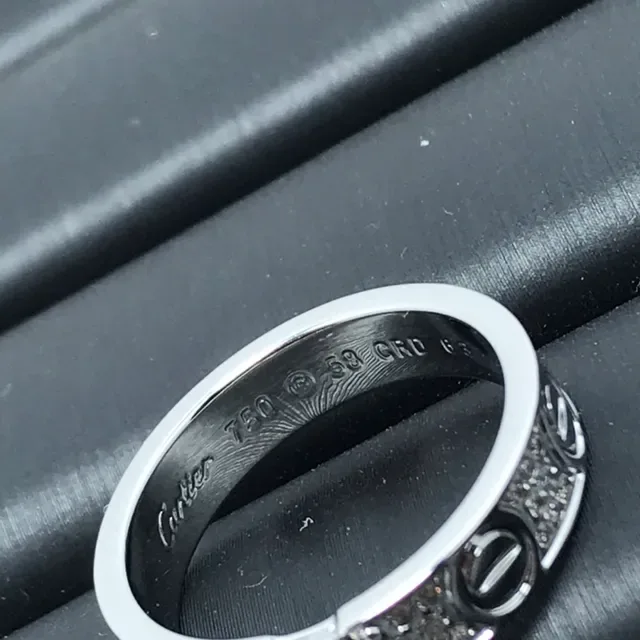 Cartier Love Ring Silver and Gold Pavé Diamond Central Stone Rings 3