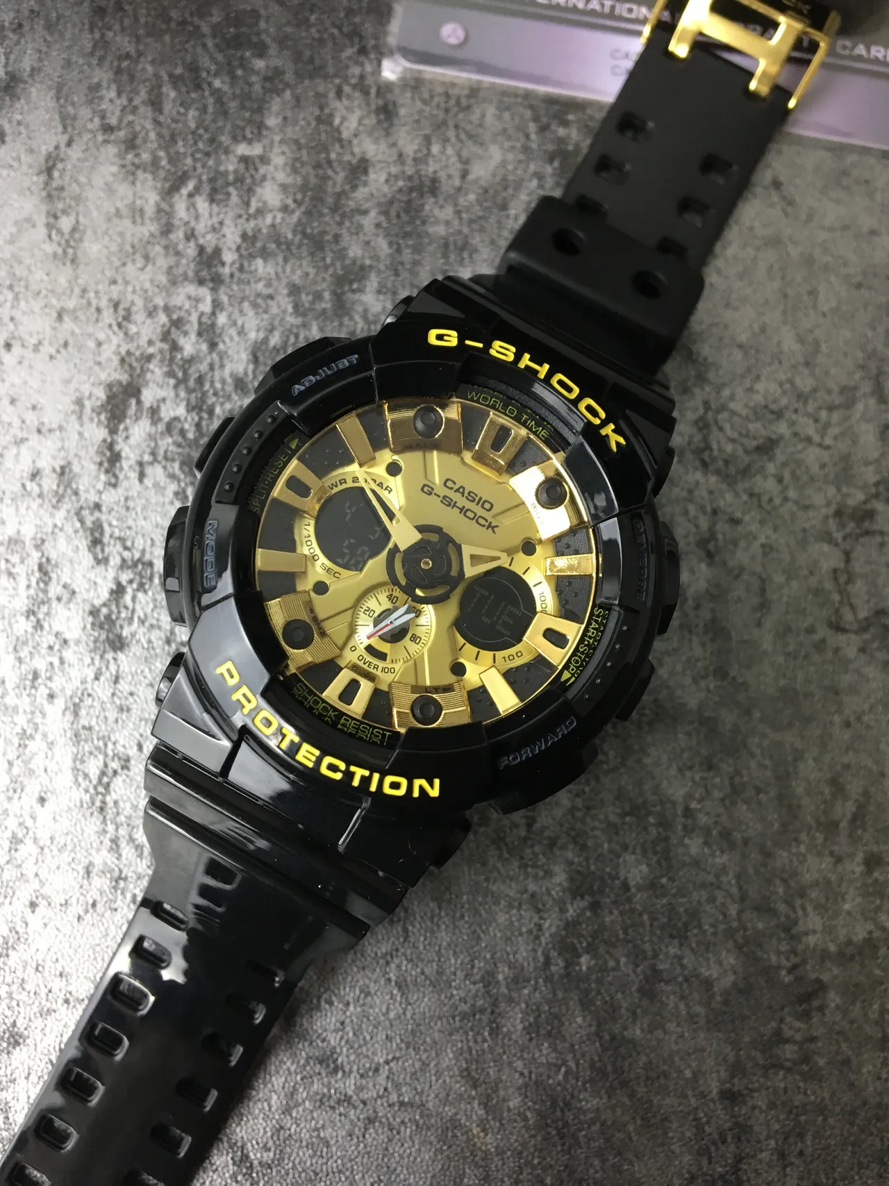 Casio G-Shock GA-100 काली और सुनहरी खेल की घड़ी 4