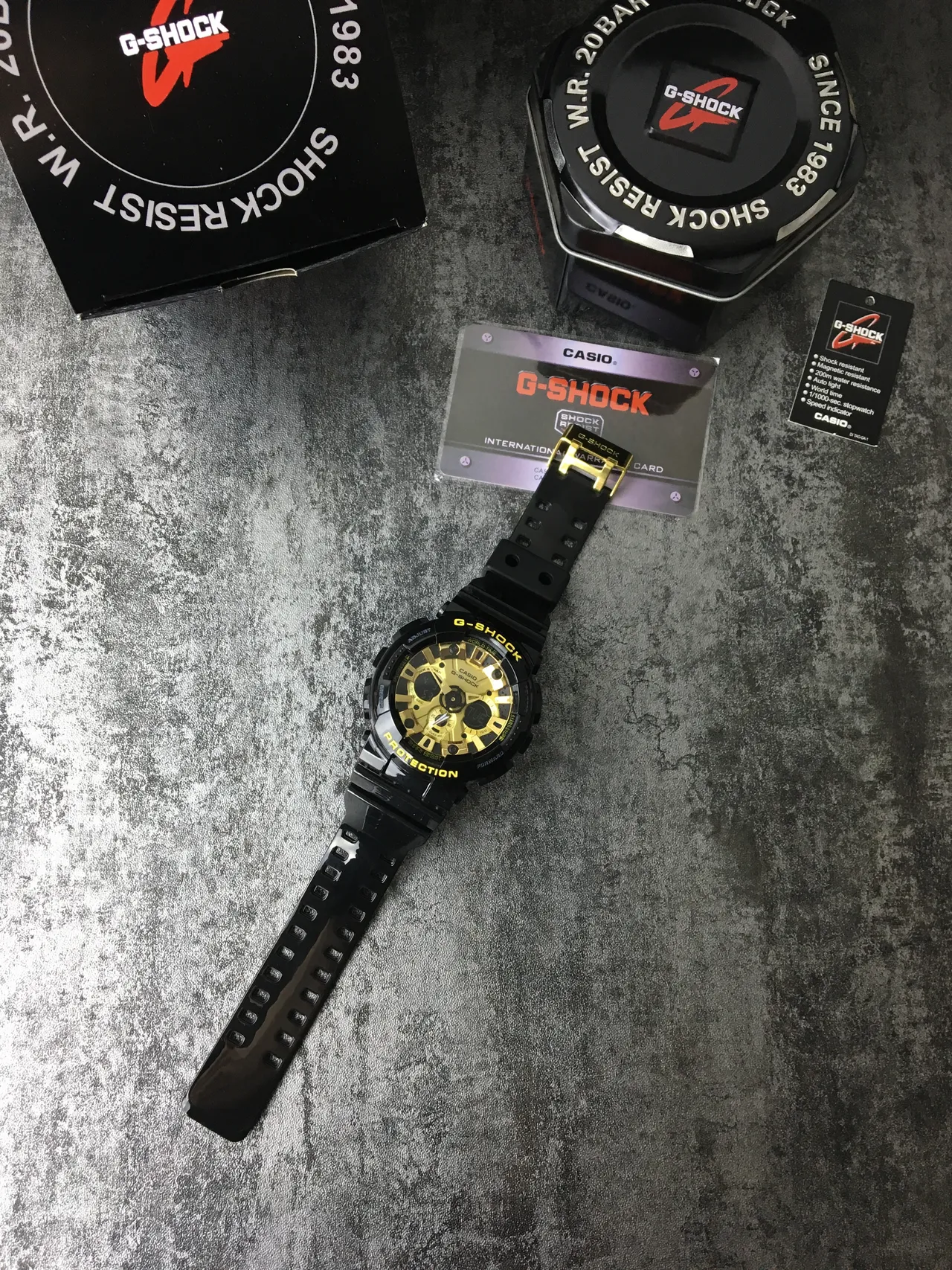 Casio G-Shock GA-100 काली और सुनहरी खेल की घड़ी 5
