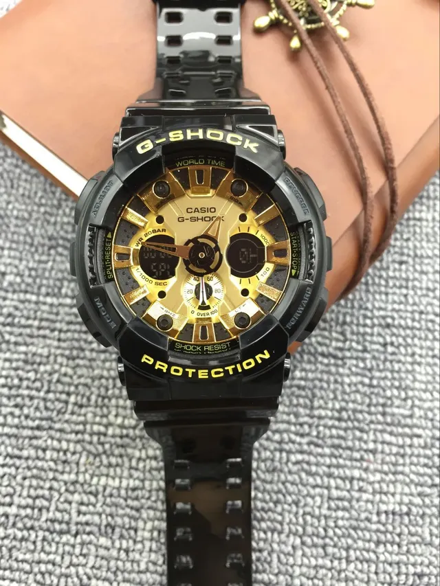 Casio G-Shock GA-100 काली और सुनहरी खेल की घड़ी 7