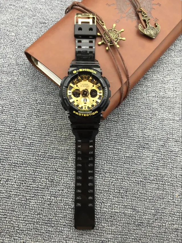 Casio G-Shock GA-100 काली और सुनहरी खेल की घड़ी 10