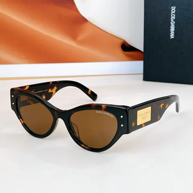 Dolce & Gabbana Lunettes de soleil noir doré silhouette chat-eye monture acétate 2