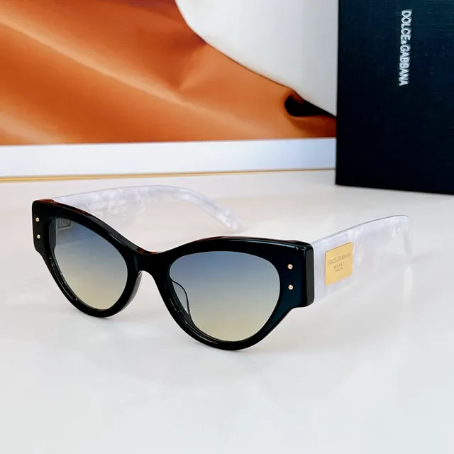 Dolce & Gabbana Lunettes de soleil noir doré silhouette chat-eye monture acétate 4