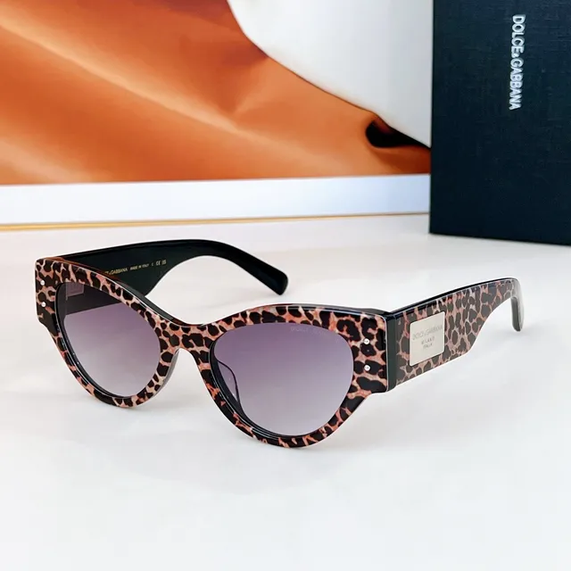 Dolce & Gabbana Lunettes de soleil noir doré silhouette chat-eye monture acétate 5