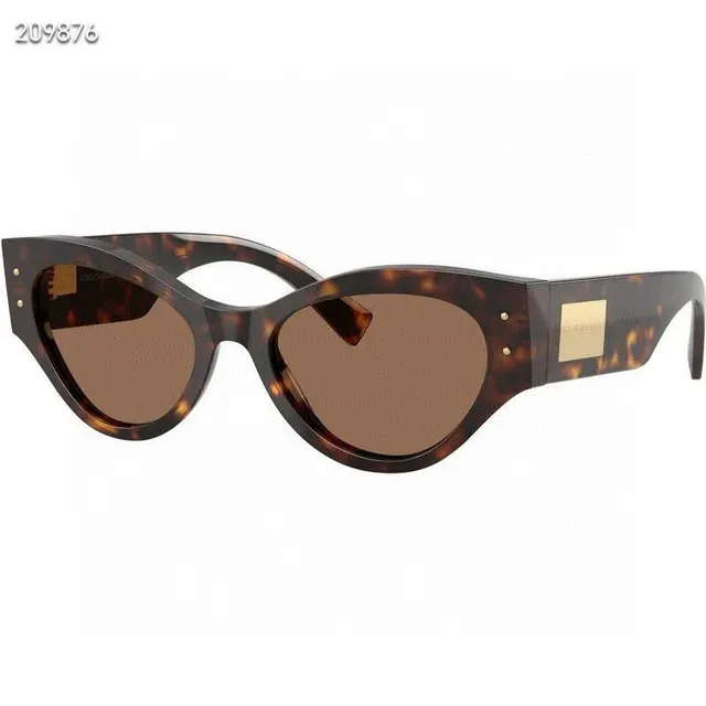 Dolce & Gabbana Lunettes de soleil noir doré silhouette chat-eye monture acétate 9