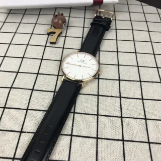 Daniel Wellington क्लासिक ब्लैक गोल्ड मिनिमलिस्ट पतली केस क्वार्ट्ज घड़ी
