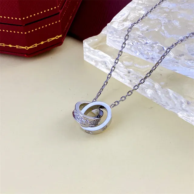 Gold and Silver Interlocking Ring Pendant Necklaces 5