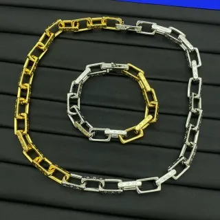 Collier chaîne à maillons rectangulaires en métal bicolore or argent