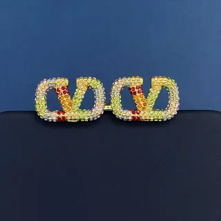 Joyas de cristal multicolor pavé de tono dorado con motivo V