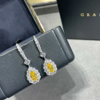 Brincos em forma de pera com gema amarela e halo pendentes