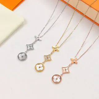 Collier argent et or avec pendentif floral et maillons géométriques