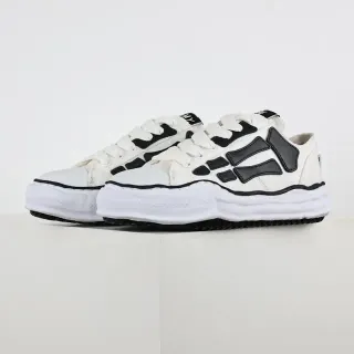 Sneakers lifestyle blanc et noir en toile supérieure avec overlays asymétriques