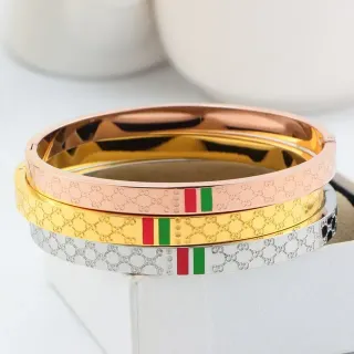 Gucci GG Marmont ذهبي أحمر Interlocking Monogram Enamel Web Stripe سوار