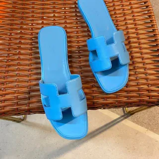 Hermès Zapatilhas de sola plana com alça em forma de H em azul
