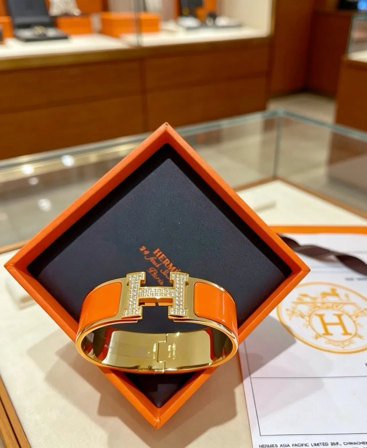 Hermès Clic H Orange Enamel Paved Crystal Gold-Tone Bracelet 6