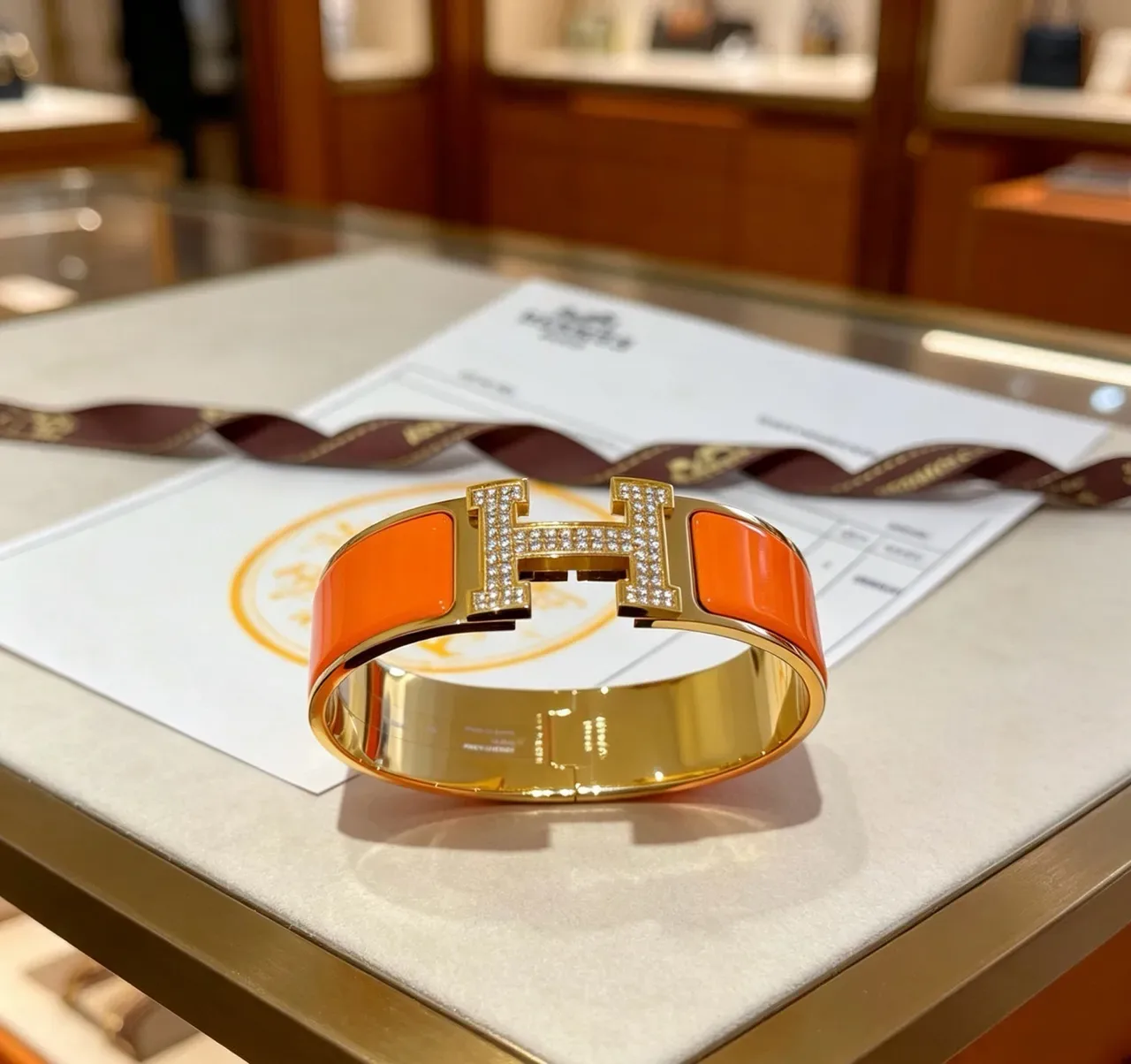 Hermès Clic H Orange Enamel Paved Crystal Gold-Tone Bracelet 9
