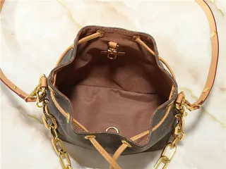 Louis Vuitton Beige Gold Monogram-Embossed Leather Chain Strap Bucket Bag 2