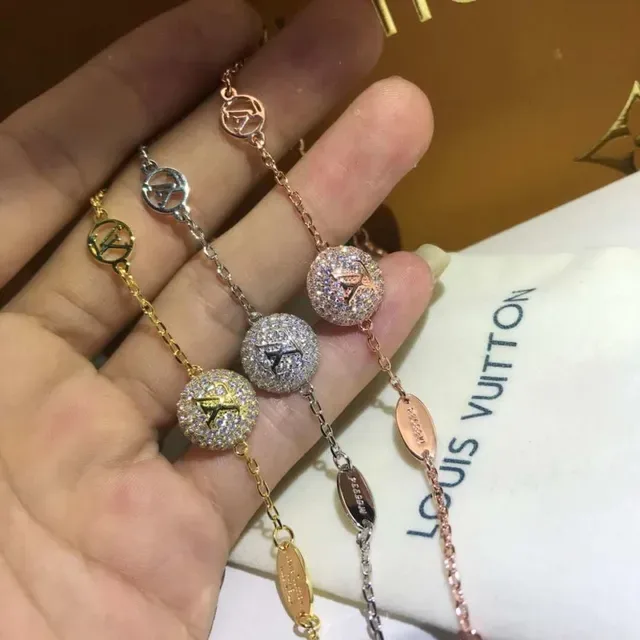 سوار لويس فتون كرة متلألئة بلون ذهبي وردي LV مونوغرام 2