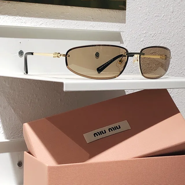 Miu Miu Lunettes de Soleil Rectangulaires Sans Monture Métal Noir 6
