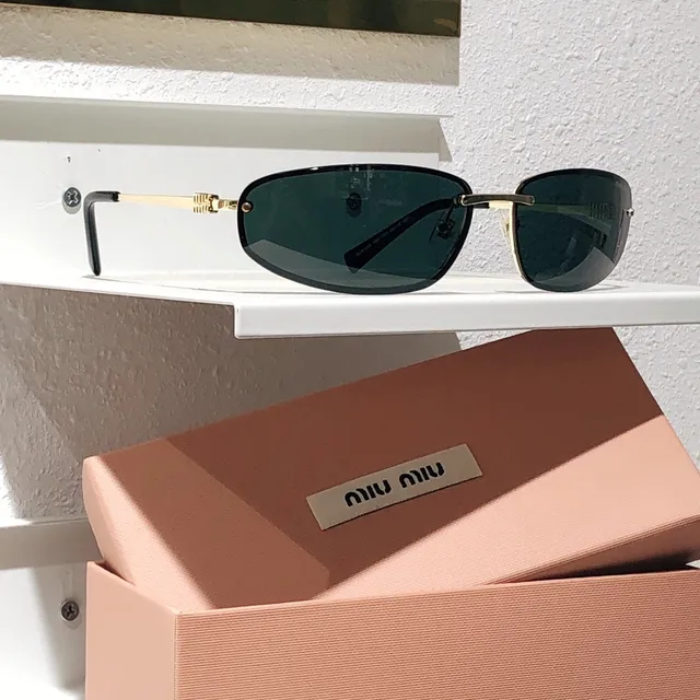 Miu Miu Lunettes de Soleil Rectangulaires Sans Monture Métal Noir 8