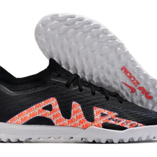 Nike Sapatos de futebol para grama artificial preto e laranja com upper de knit e overlay gráfico