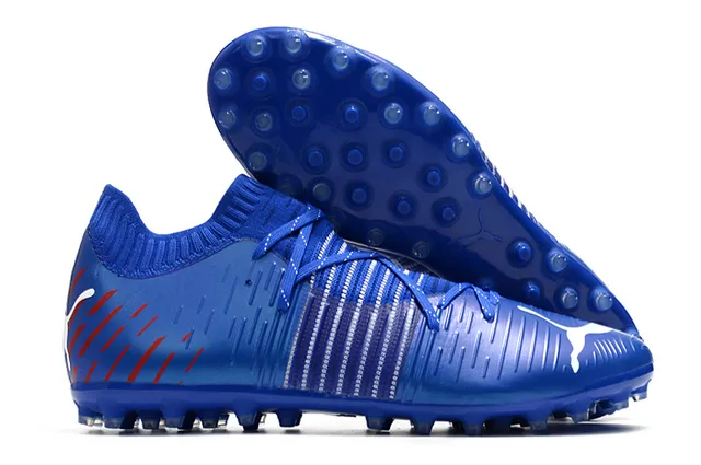 Puma Future Z Chaussures de football orange et jaune avec upper en knit, ajustement sock-fit, cage à lacets intégrée, terrain ferme 7