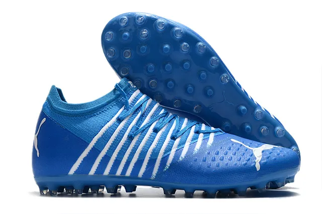 Puma Future Z Chaussures de football orange et jaune avec upper en knit, ajustement sock-fit, cage à lacets intégrée, terrain ferme 22