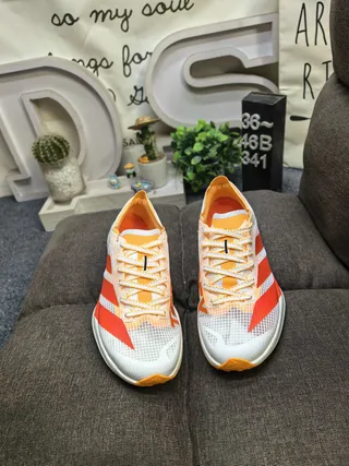 Adidas Tênis de corrida com upper de malha engenheirada preto e amarelo forro de gola 10