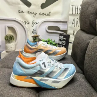 Adidas Tênis de corrida azul laranja silhueta de corrida simplificada malha superior engenheirado