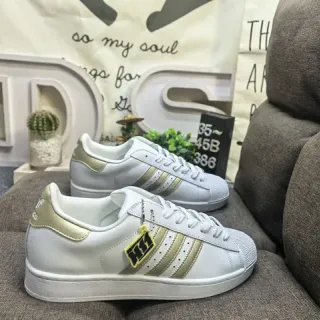 Adidas Superstar أبيض وذهبي أحذية رياضية أسلوبية