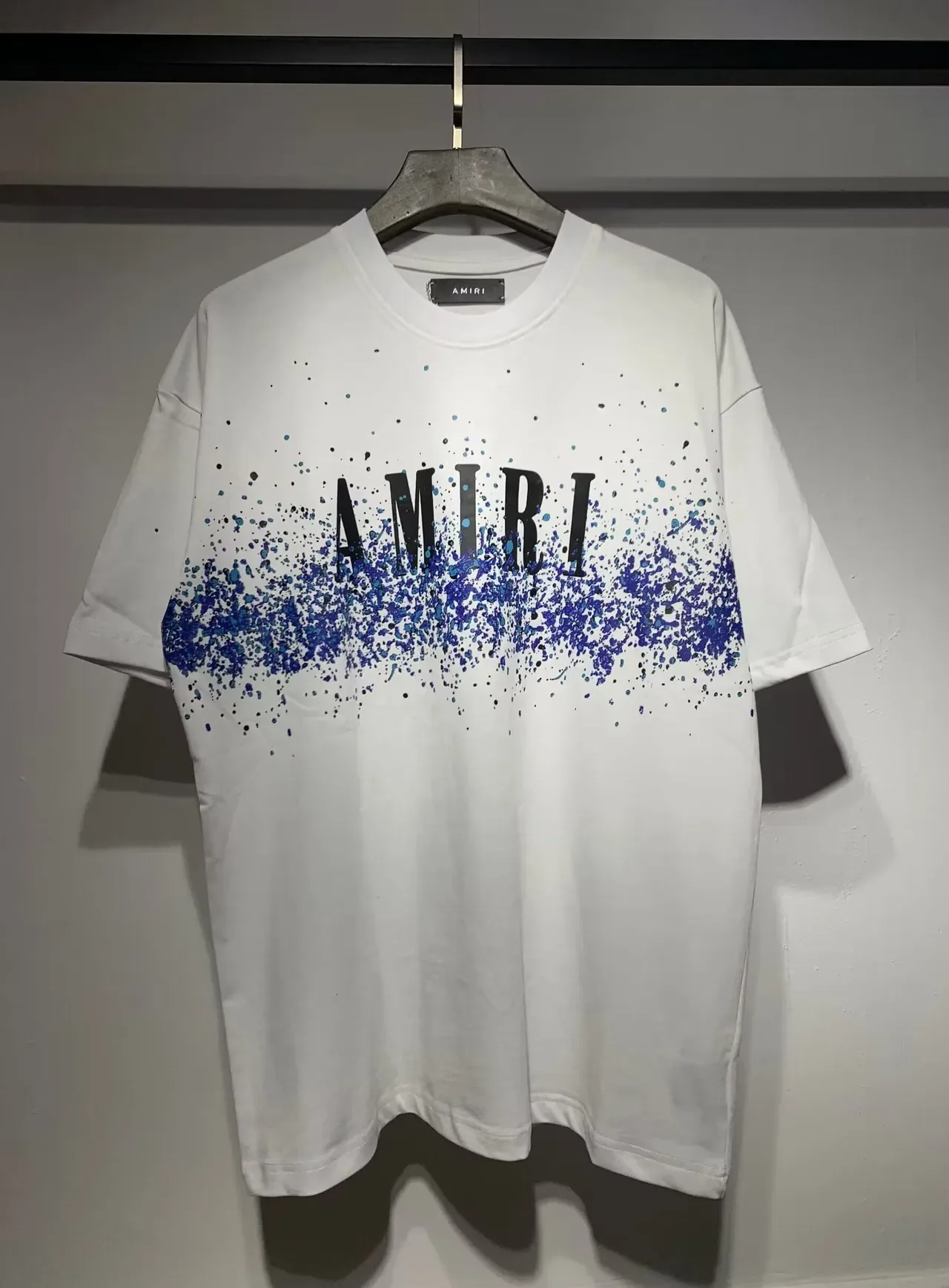 Camiseta Amiri com logo gráfico de respingos 11