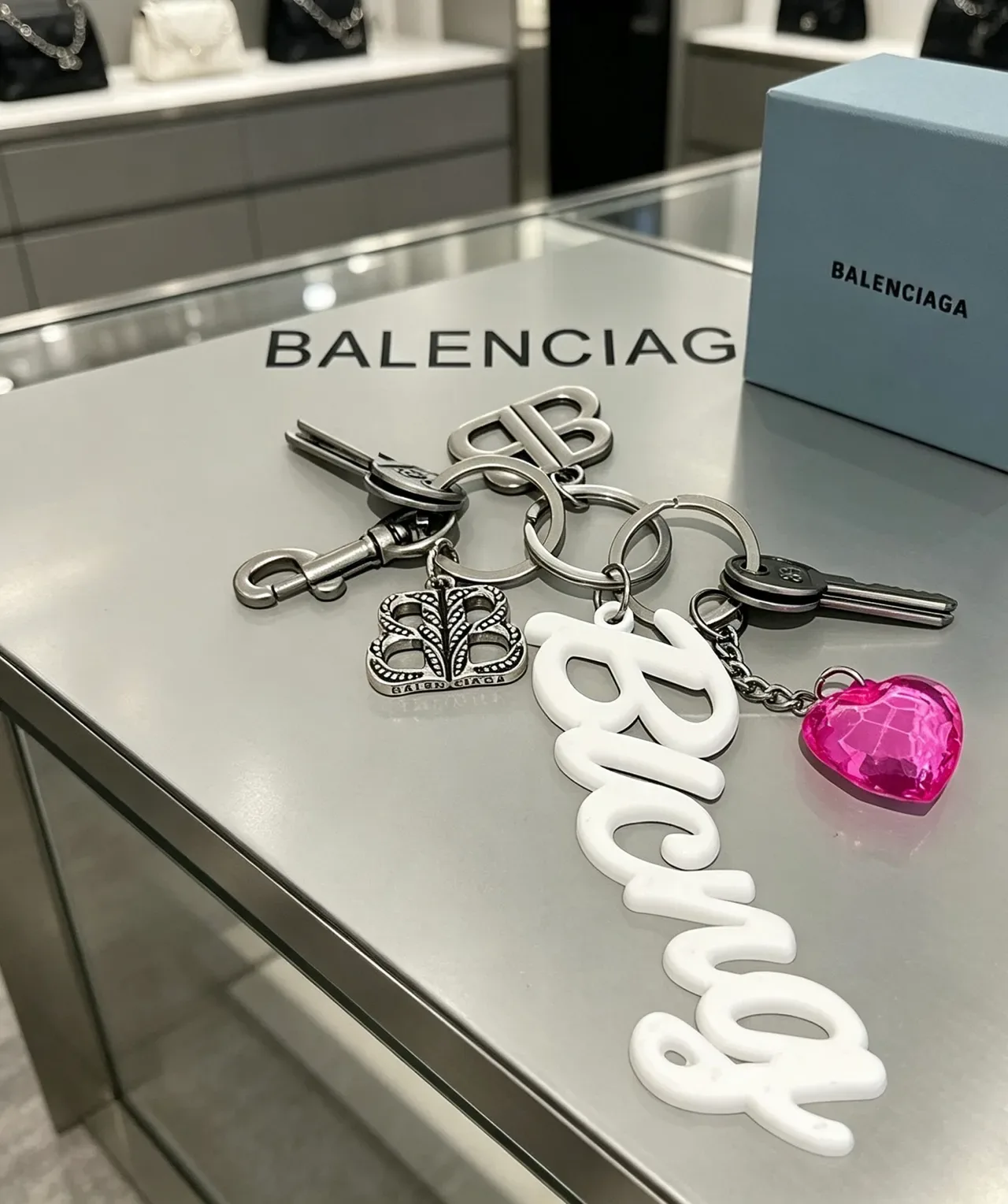 Balenciaga Keychain Collection White Silver Cursive Logo Metallic Monogram Bracelet 6