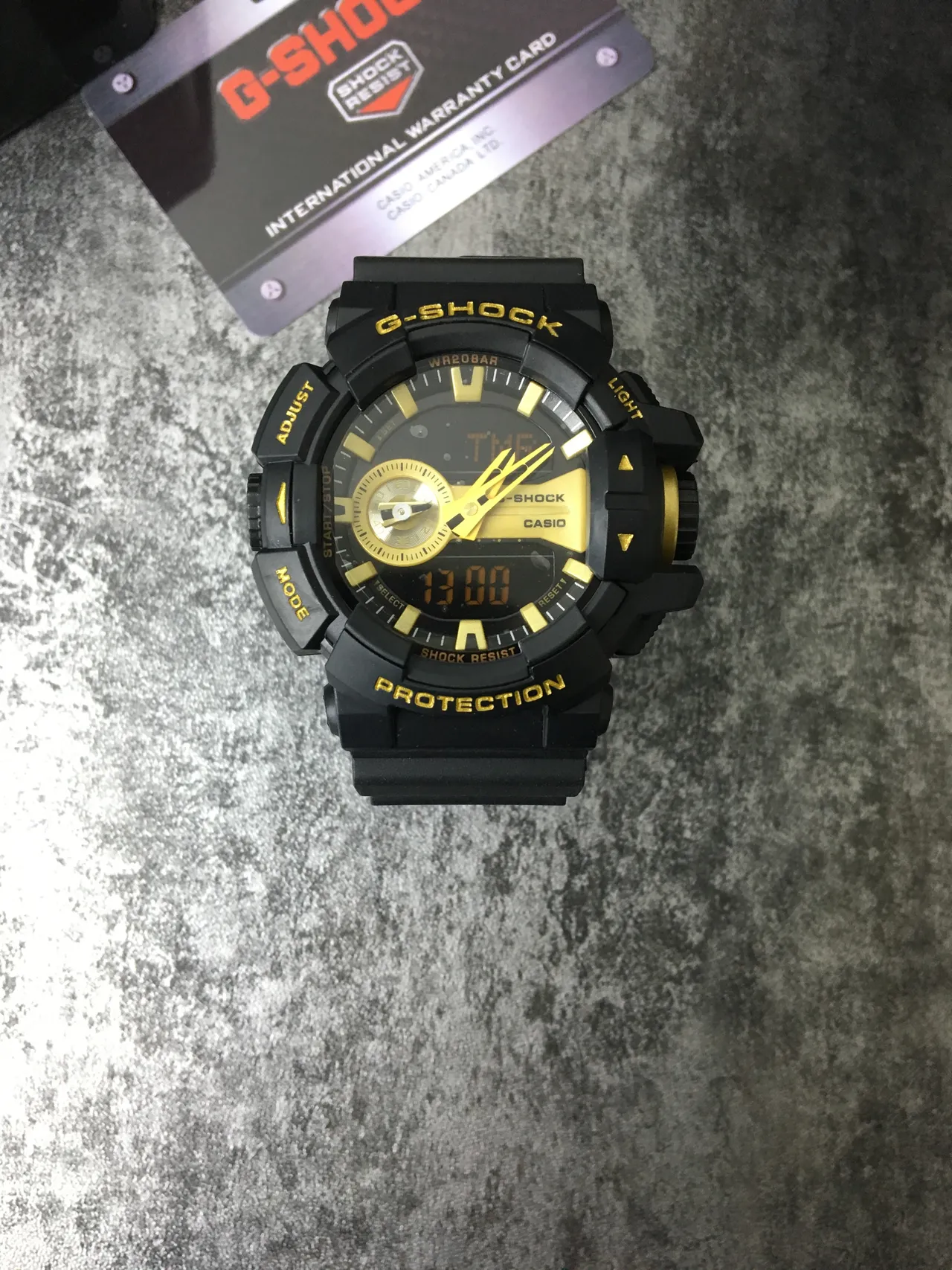 Casio G-Shock GA-100 Black and Gold Sports Watch 2