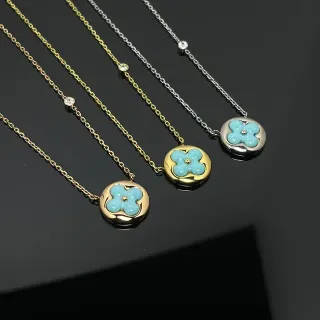Collier avec pendentif circulaire or bleu motif fleur émaillé