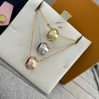 Collier pendentif barreau géométrique facetté multi-face en or et argent