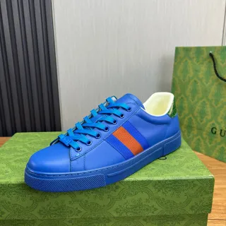 Gucci Zapatillas lifestyle de cuero superior azul naranja vibrante con detalle de rayas web