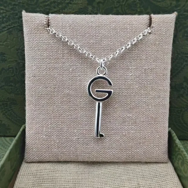 Gucci GG Key Double G Motif أقراط بلون فضي وأسود مينا 7