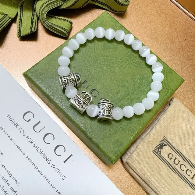 Gucci Pulseira com contas de olho de gato branco e encanto G interlocking 9