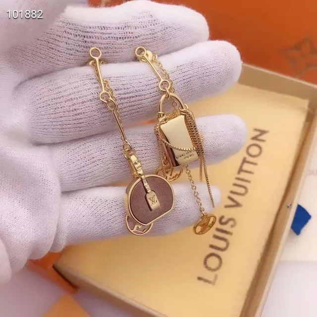 Louis Vuitton Asymmetrical Monogram Lock Motif Gold-Tone Earrings 5