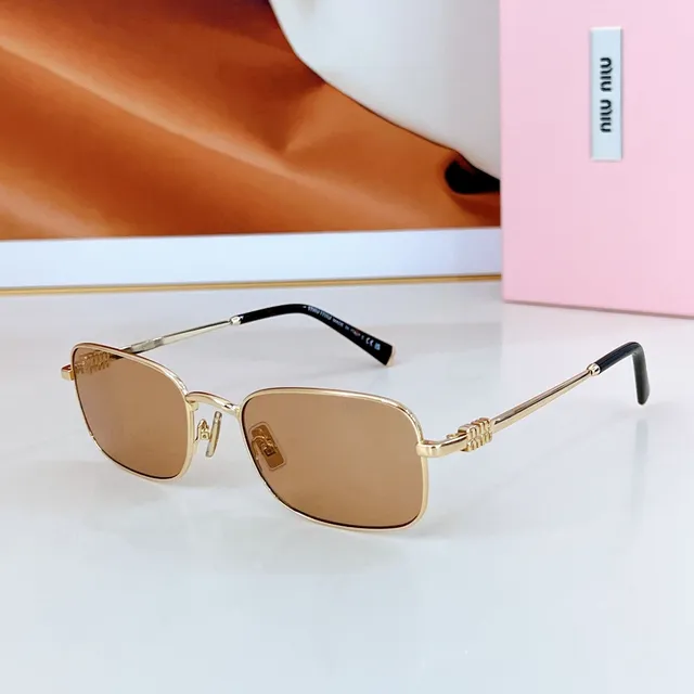 Miu Miu lunettes de soleil vert argent cadre rectangulaire construction métallique 5