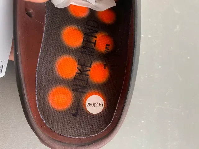 Nike أسود وبرتقالي سليب أون سكالبتد ويفي ميد سول سنيكرز 9