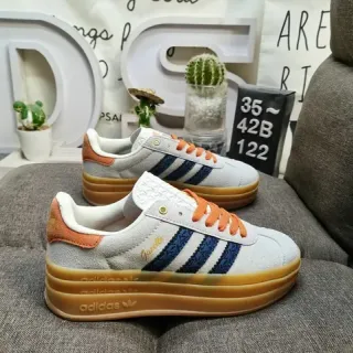 Adidas Gazelle رمادي فاتح أزرق بحري برتقالي غوم حذاء رياضي lifestyle