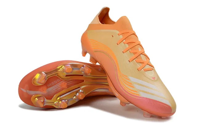 Adidas Chaussures de football orange doré à bas de coupe avec upper synthétique overlay à motif de vague surface de terrain ferme 4