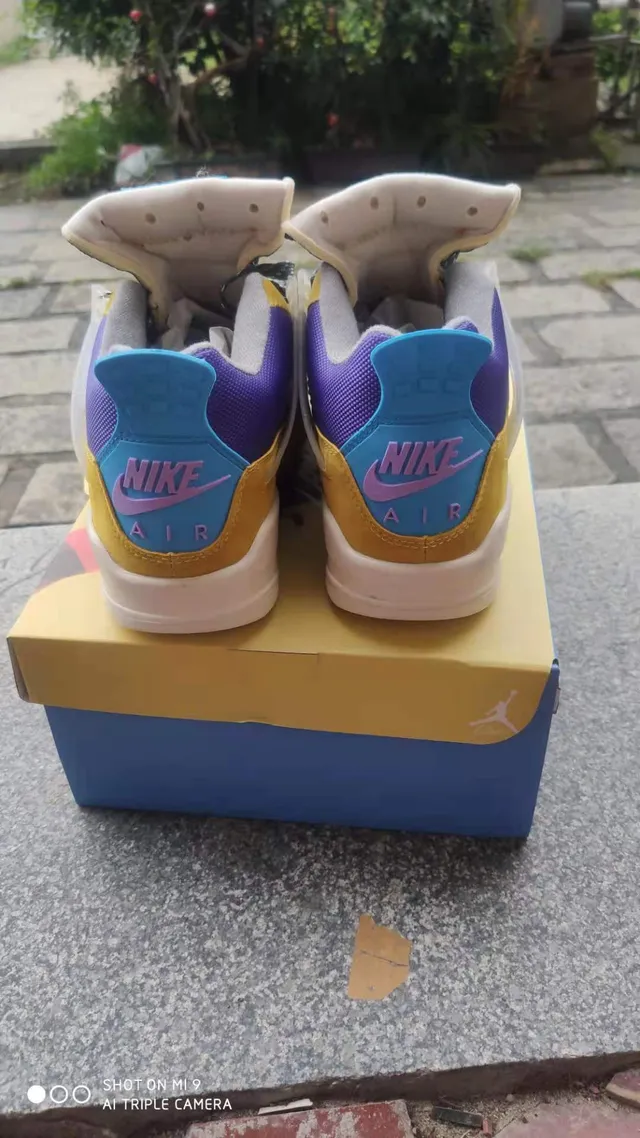 حذاء كرة السلة Air Jordan 4 Retro أصفر بنفسجي سماوي 5