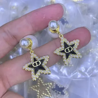 Boucles d'oreilles Dior Gold Black en forme d'étoile ornées de perles