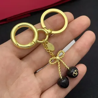 سوار معدني ذهبي أسود مع حبل ملتف وشكل قوس