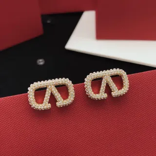 Brincos de pasador de tom dourado com cristais Pavé de logo geométrico